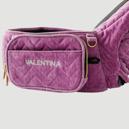 Purple baby carrier with 'Valentina' branding on a light gray background